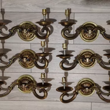Set of 6 gilt bronze wall lights with two arms.